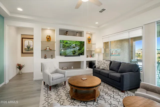 a living room with furniture and a large window