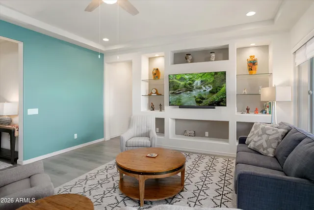 a living room with furniture and a large window