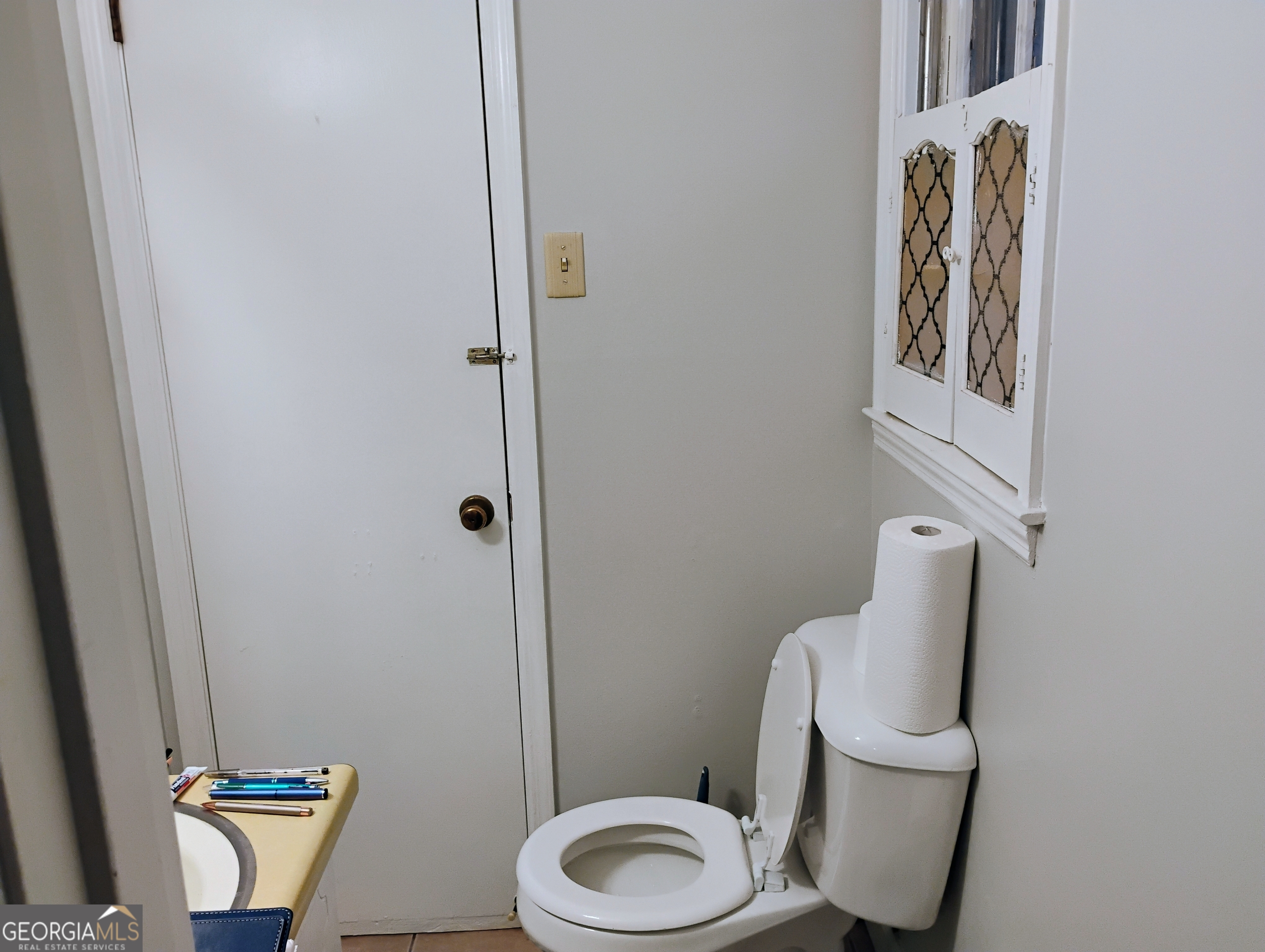 6501 River Run Road Riverdale, GA 30274 - Photo 14 of 18 a bathroom with a toilet and a mirror