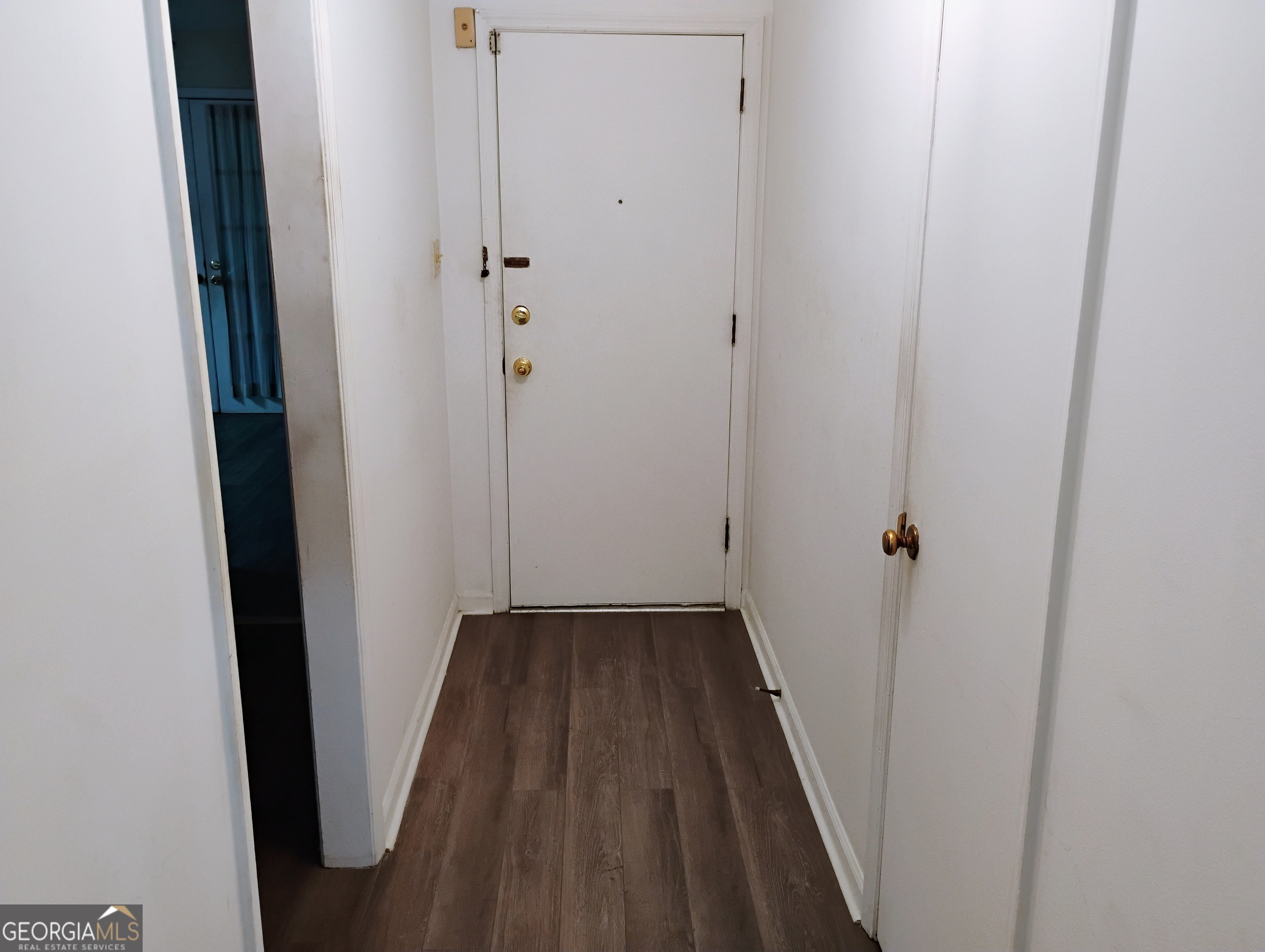 6501 River Run Road Riverdale, GA 30274 - Photo 17 of 18 a view of a hallway with wooden floor