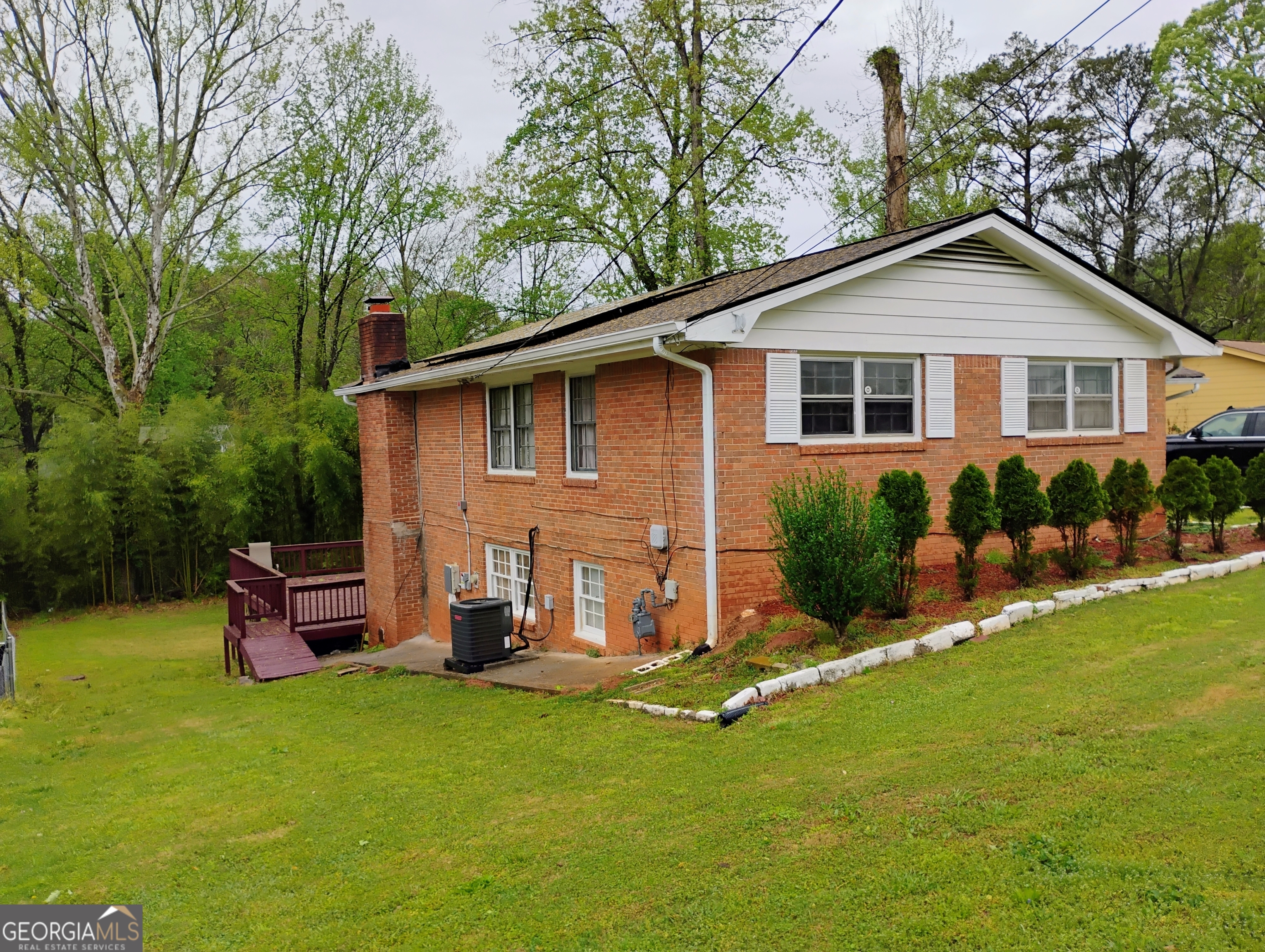 6501 River Run Road Riverdale, GA 30274 - Photo 2 of 18 a front view of house with yard and green space