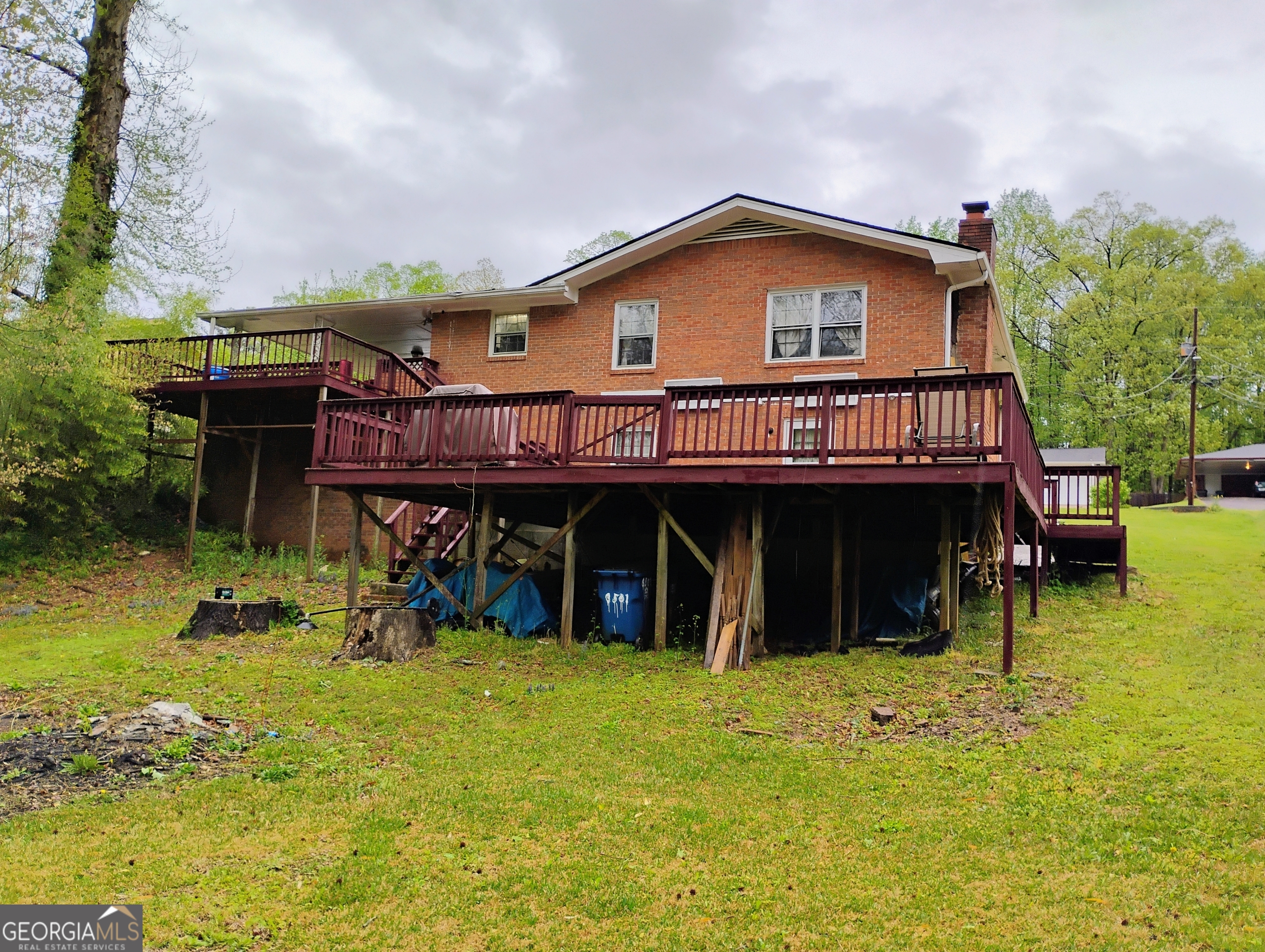 6501 River Run Road Riverdale, GA 30274 - Photo 3 of 18 a view of a house with a patio and a yard