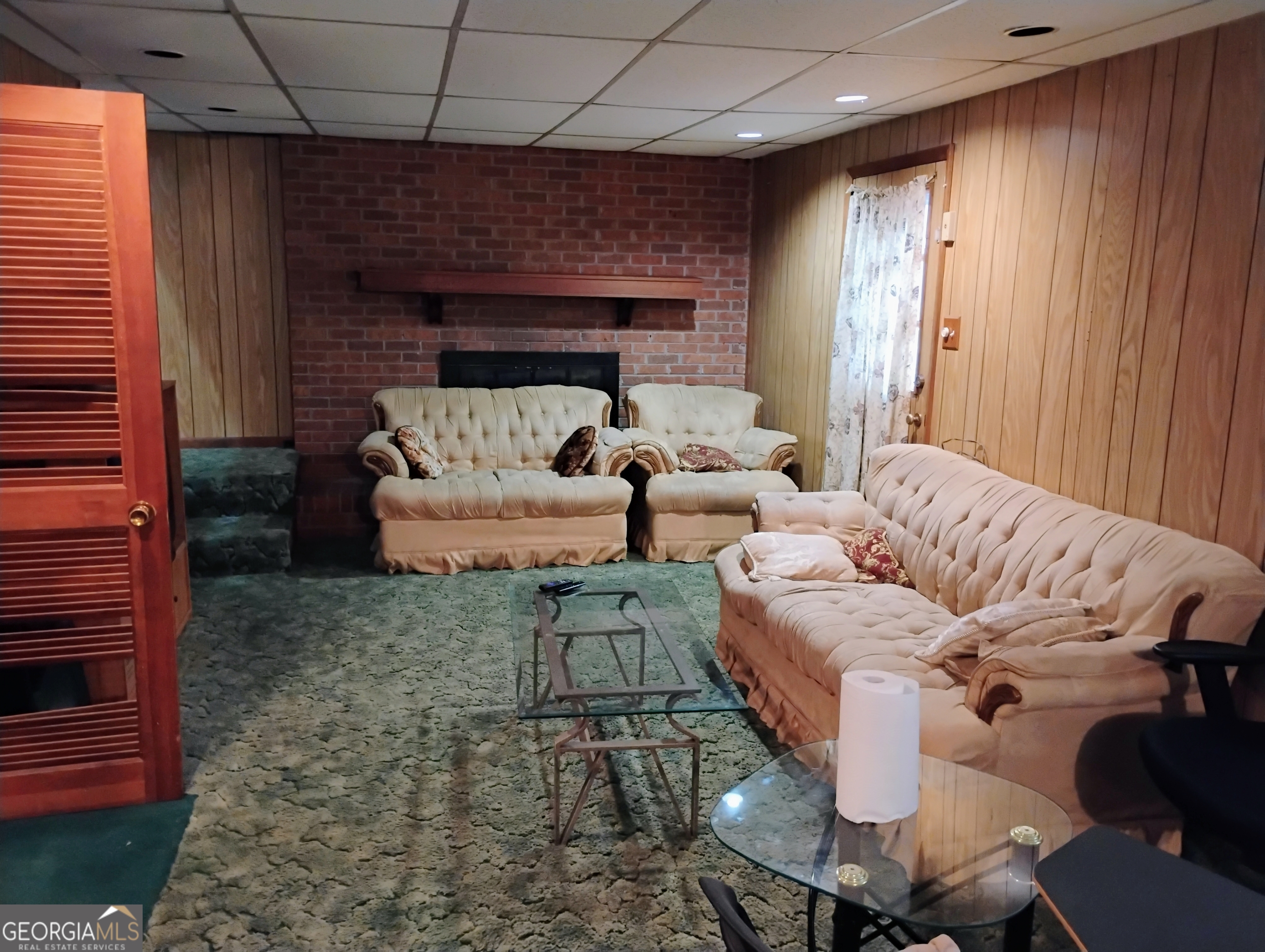6501 River Run Road Riverdale, GA 30274 - Photo 8 of 18 a living room with furniture and a fireplace