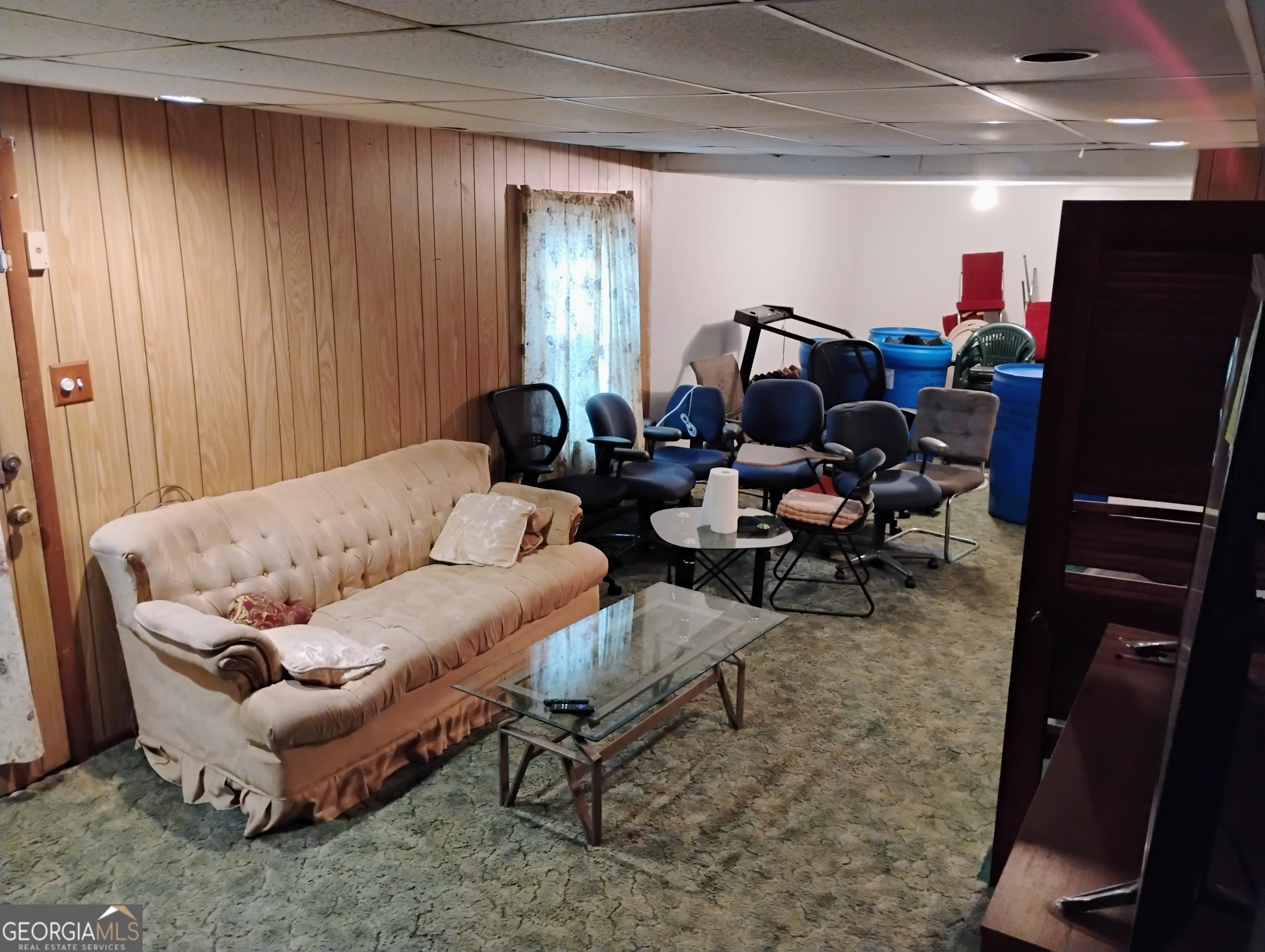 6501 River Run Road Riverdale, GA 30274 - Photo 9 of 18 a living room with furniture a rug and gym equipment