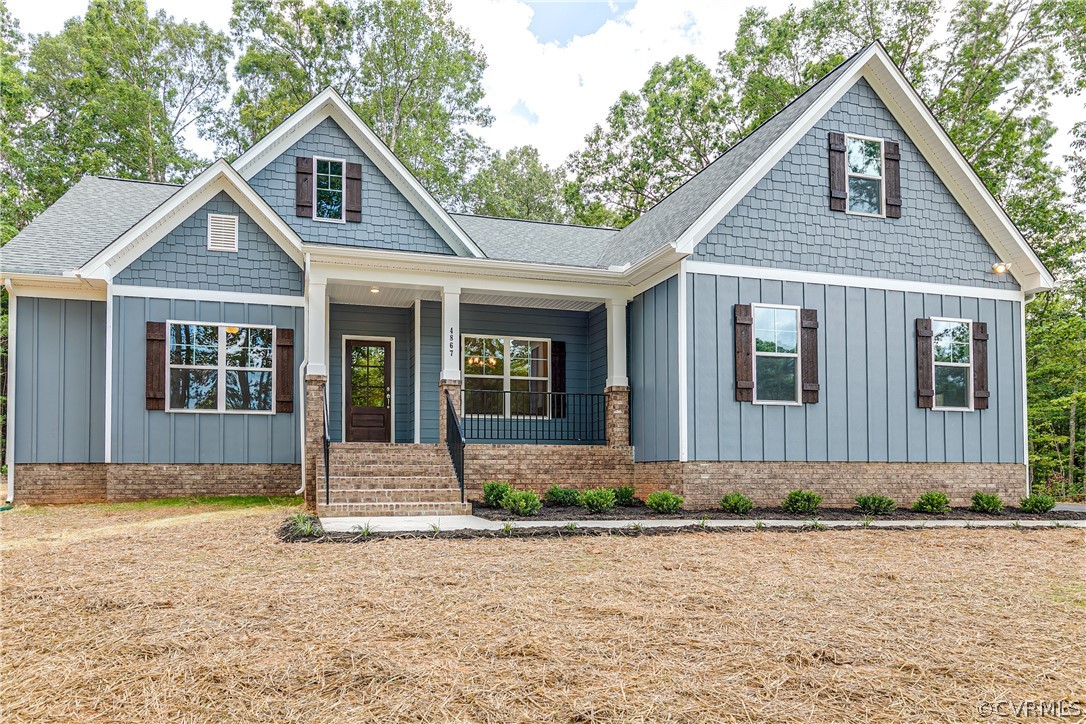 3663 West Rocketts Ridge Road Goochland, VA 23063 - Photo 1 of 33 a front view of a house with a yard