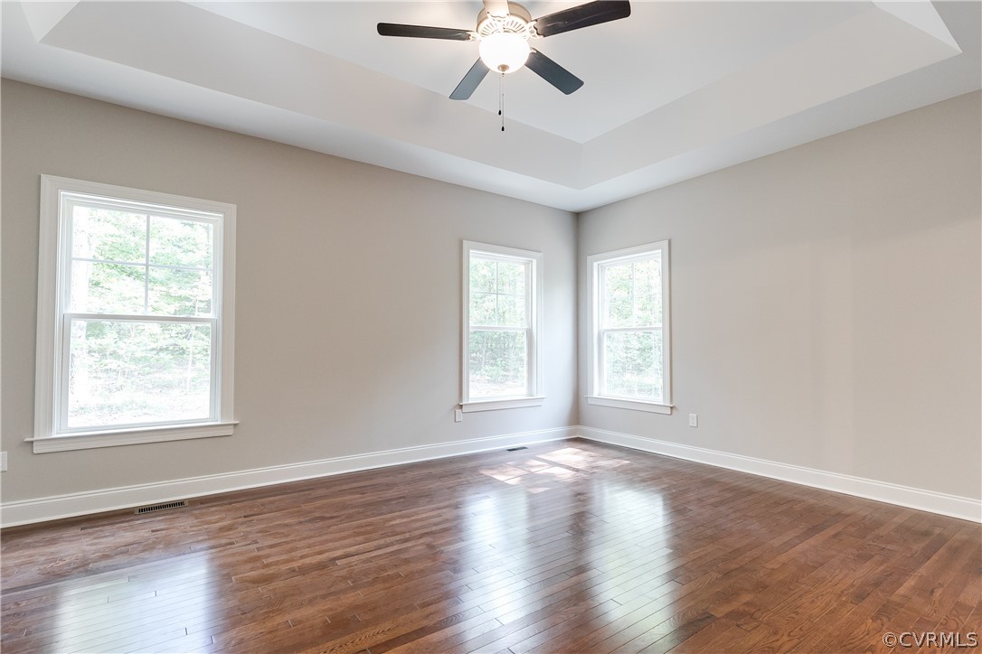 3663 West Rocketts Ridge Road Goochland, VA 23063 - Photo 23 of 33 a view of an empty room with wooden floor and a window