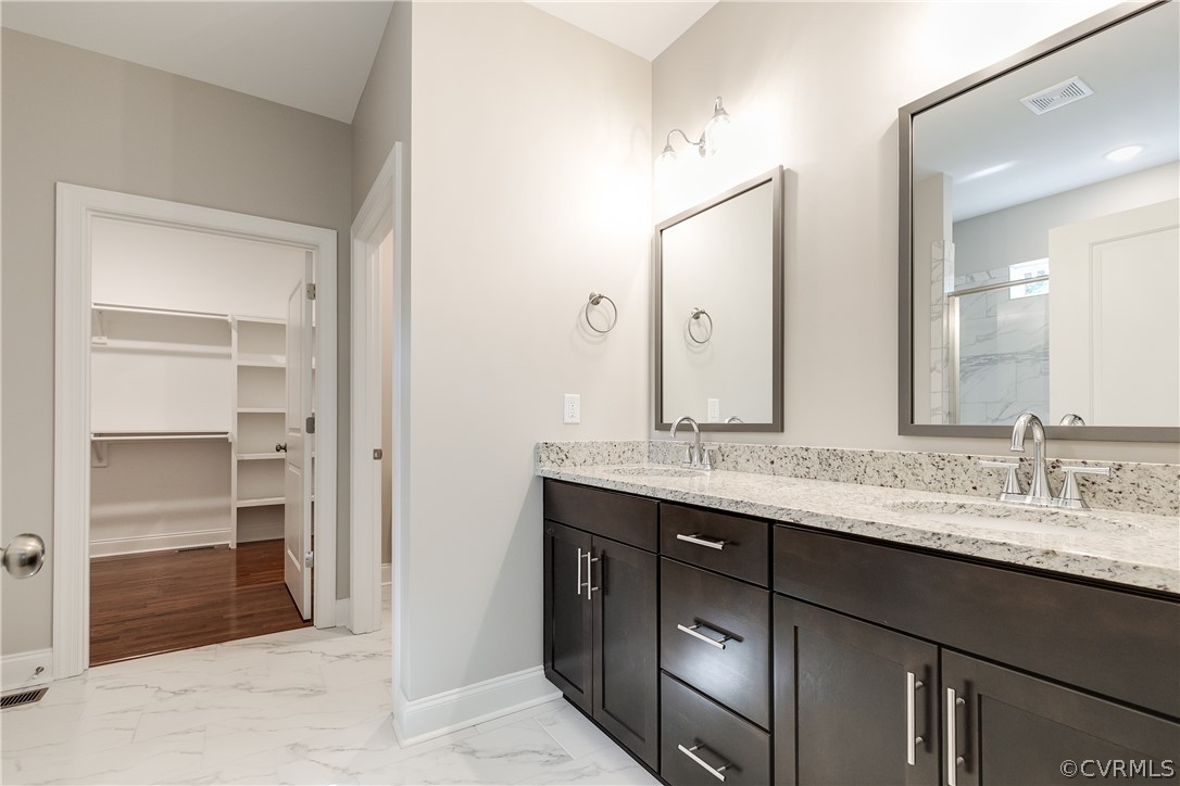 3663 West Rocketts Ridge Road Goochland, VA 23063 - Photo 26 of 33 a bathroom with a granite countertop sink and a mirror