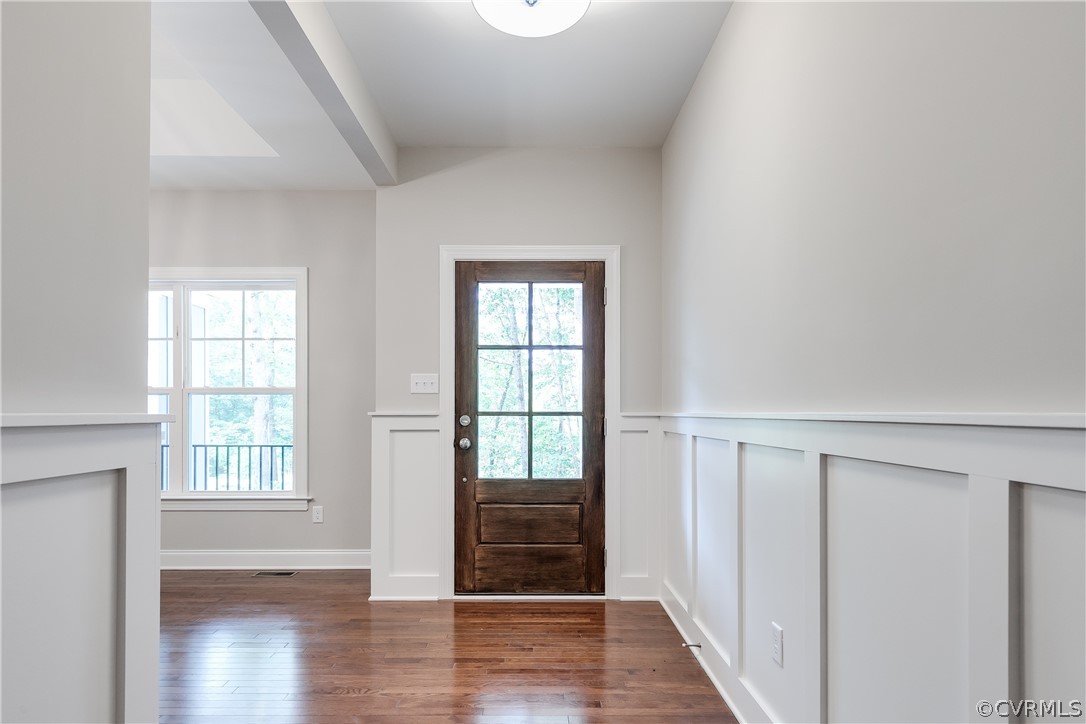 3663 West Rocketts Ridge Road Goochland, VA 23063 - Photo 6 of 33 a view of an empty room with wooden floor and a window