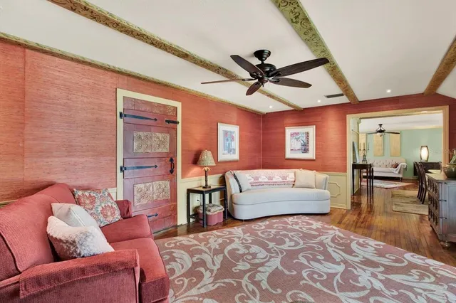 a living room with furniture and a rug