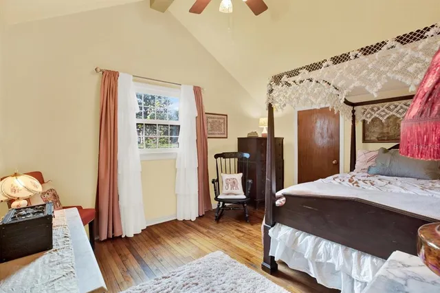 a bed room with a bed and a television