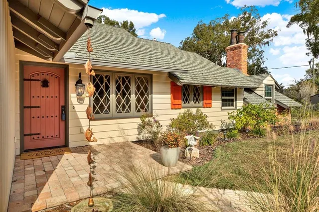 a front view of a house with large windows
