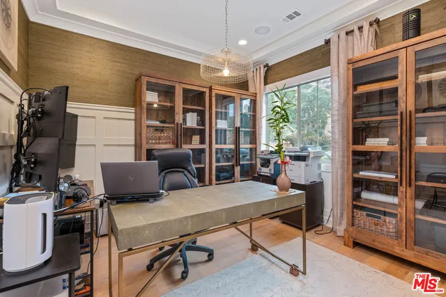 a large kitchen with a table and chairs