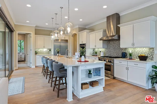 a bathroom with a toilet sink vanity and mirror