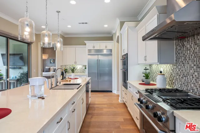 a bathroom with a shower sink vanity mirror and toilet