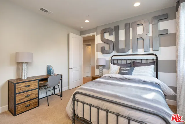 a spacious bathroom with a double vanity sink a mirror and a bathtub