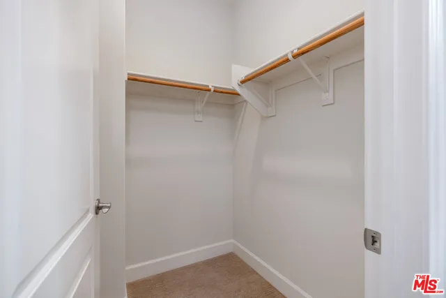 a view of a garden with a bench in a garden