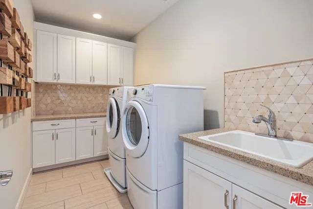 a view of a house with backyard sitting area and fire pit