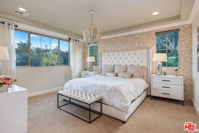 a view of a patio with table and chairs and potted plants