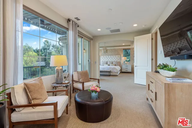 a outdoor dining space with furniture and garden view