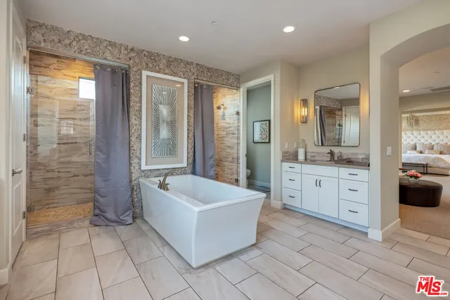 a aerial view of a house with a swimming pool patio and outdoor seating