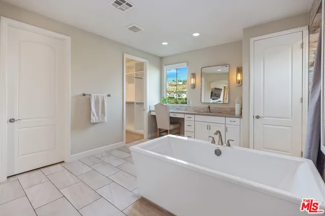 an aerial view of residential houses with outdoor space and street view
