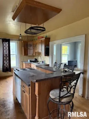 a dining table with chairs and window