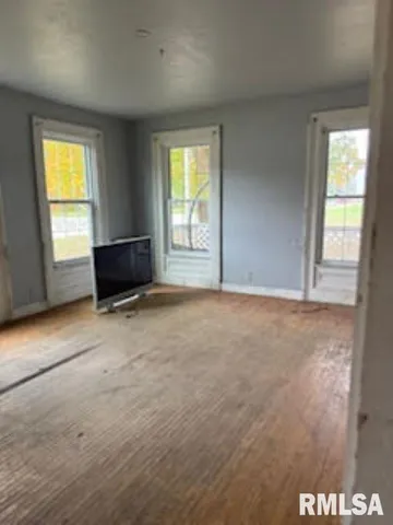 an empty room with windows