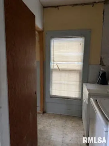 a view of an empty room and window