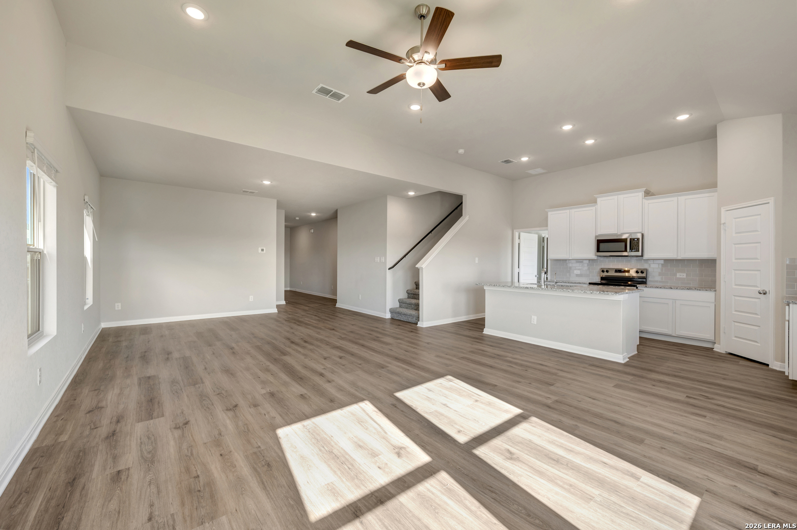 10330 Goodison Drive Converse, TX 78109 - Photo 6 of 42 a view of kitchen with cabinets stainless steel appliances and wooden floor
