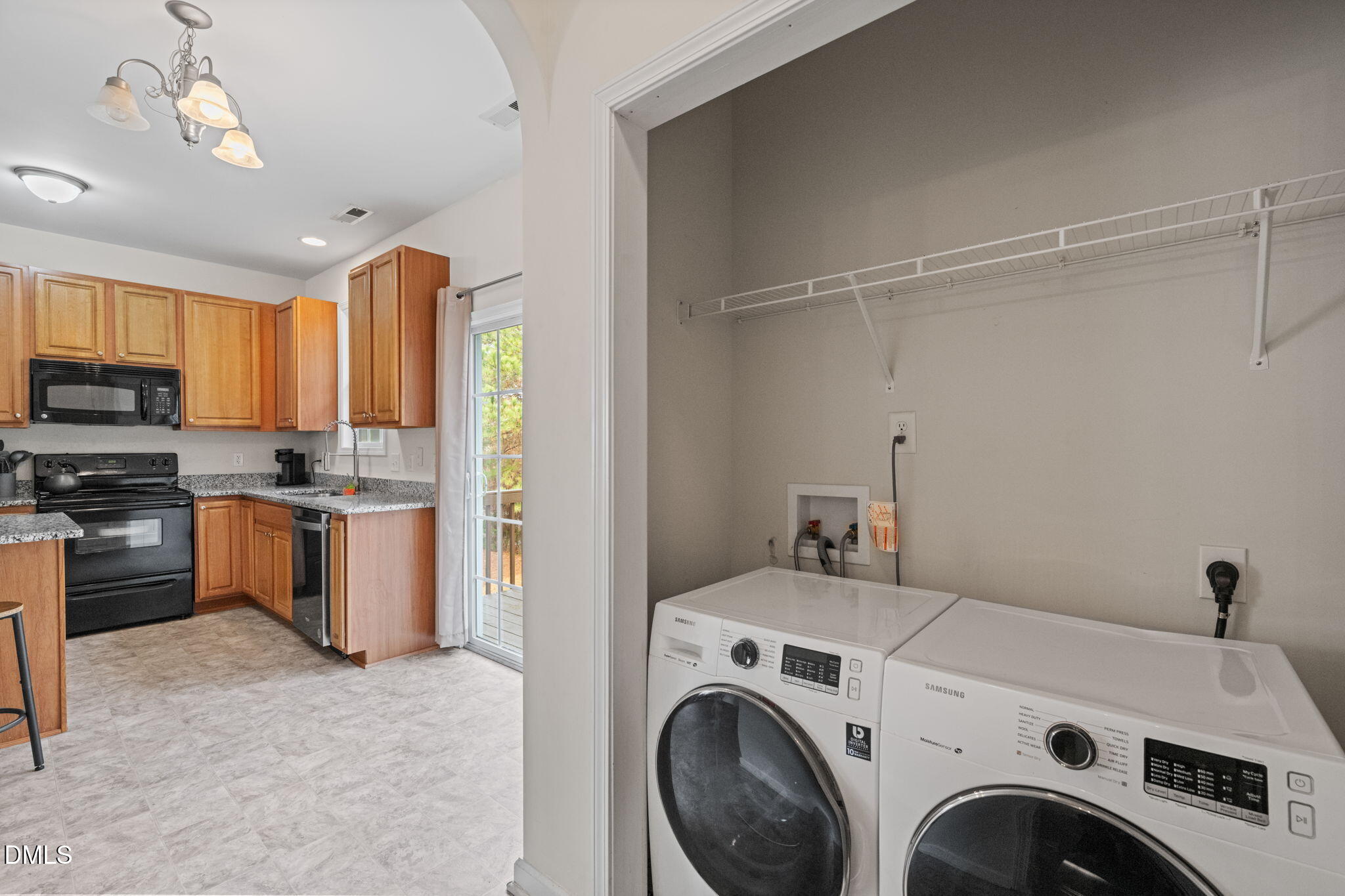 5841 Wynmore Road Raleigh, NC 27610 - Photo 16 of 40 a view of kitchen and washer and dryer