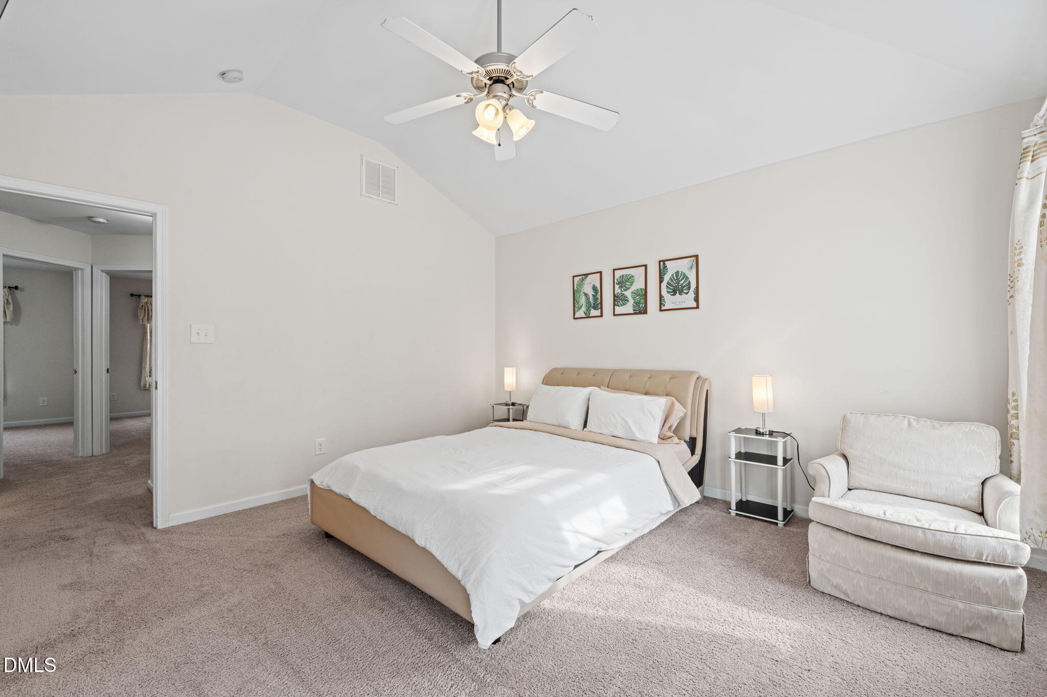 5841 Wynmore Road Raleigh, NC 27610 - Photo 19 of 40 a bedroom with a bed chandelier and a couch