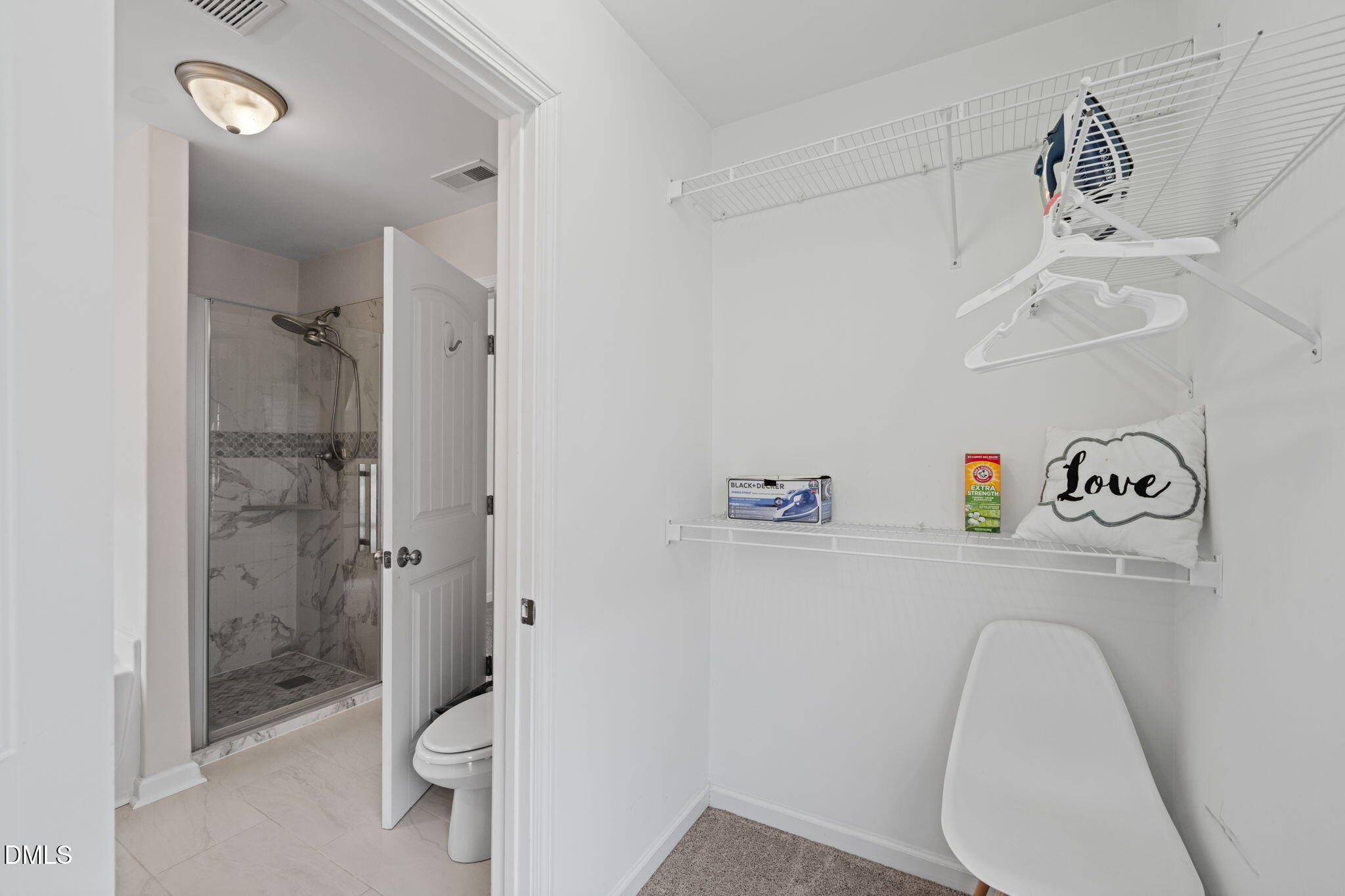 5841 Wynmore Road Raleigh, NC 27610 - Photo 22 of 40 a bathroom with a sink a toilet and shower