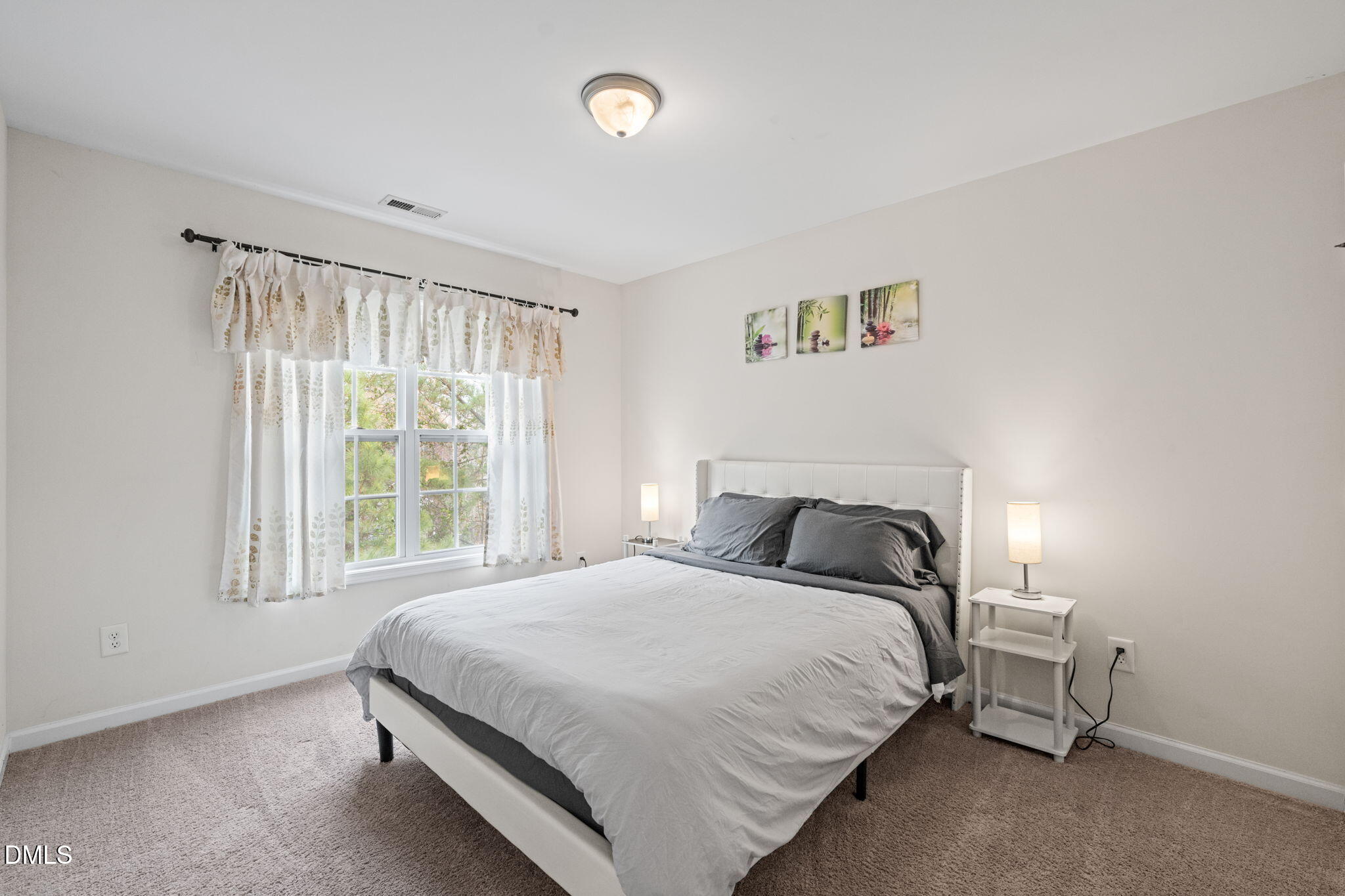 5841 Wynmore Road Raleigh, NC 27610 - Photo 25 of 40 a bedroom with a bed and a window
