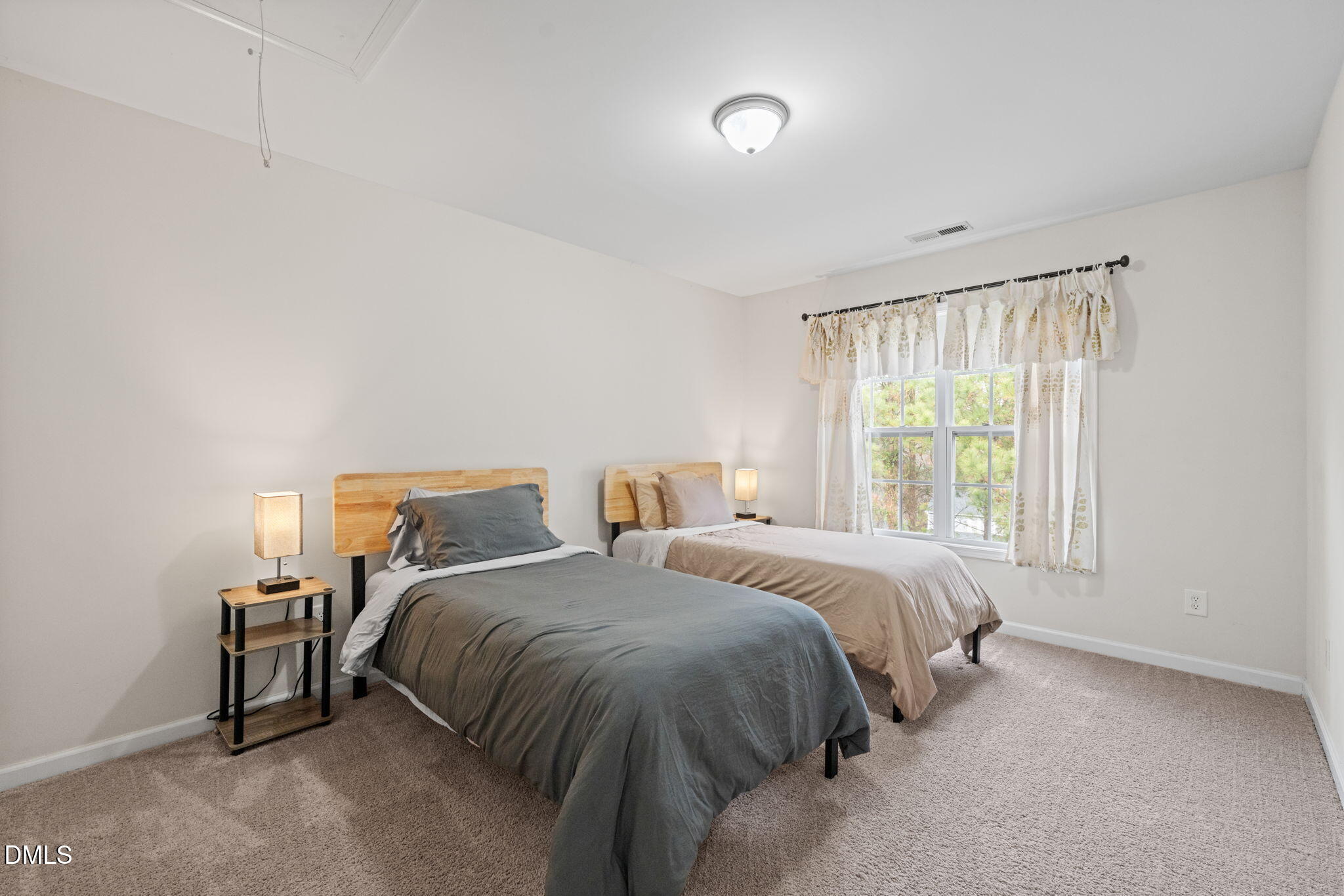 5841 Wynmore Road Raleigh, NC 27610 - Photo 28 of 40 a bedroom with a bed and a window