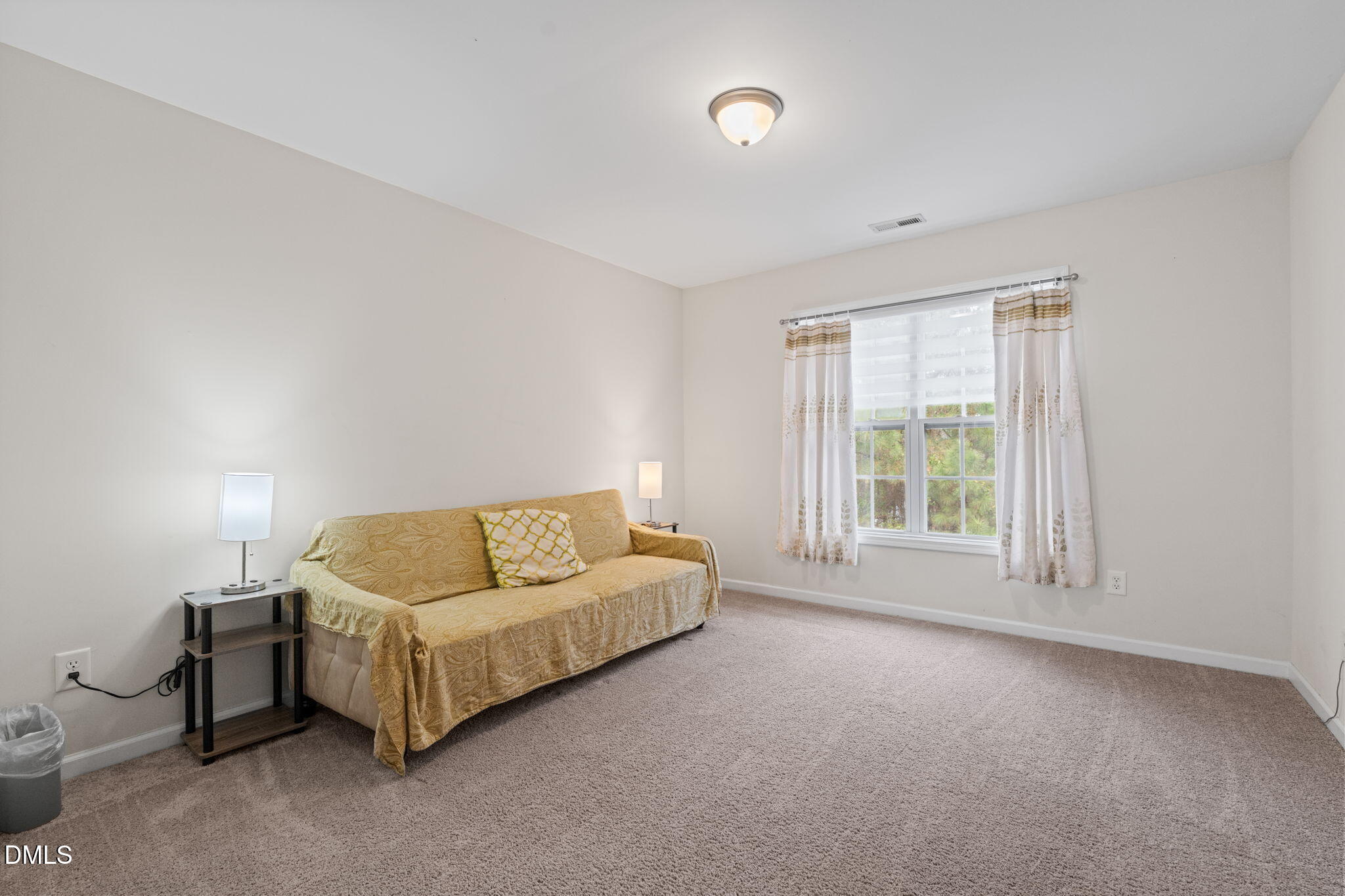 5841 Wynmore Road Raleigh, NC 27610 - Photo 30 of 40 a living room with furniture and a window