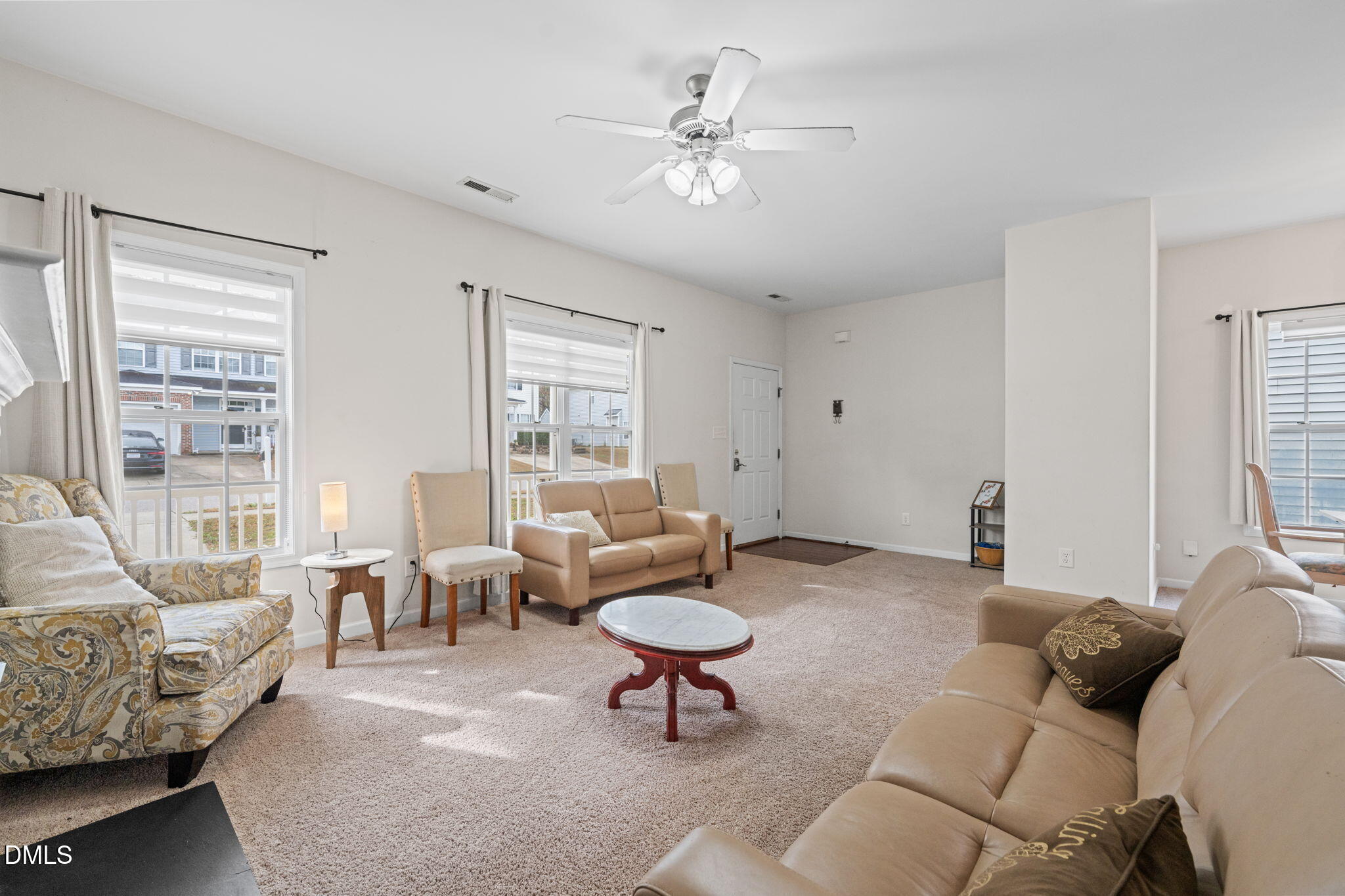5841 Wynmore Road Raleigh, NC 27610 - Photo 4 of 40 a living room with furniture and a large window