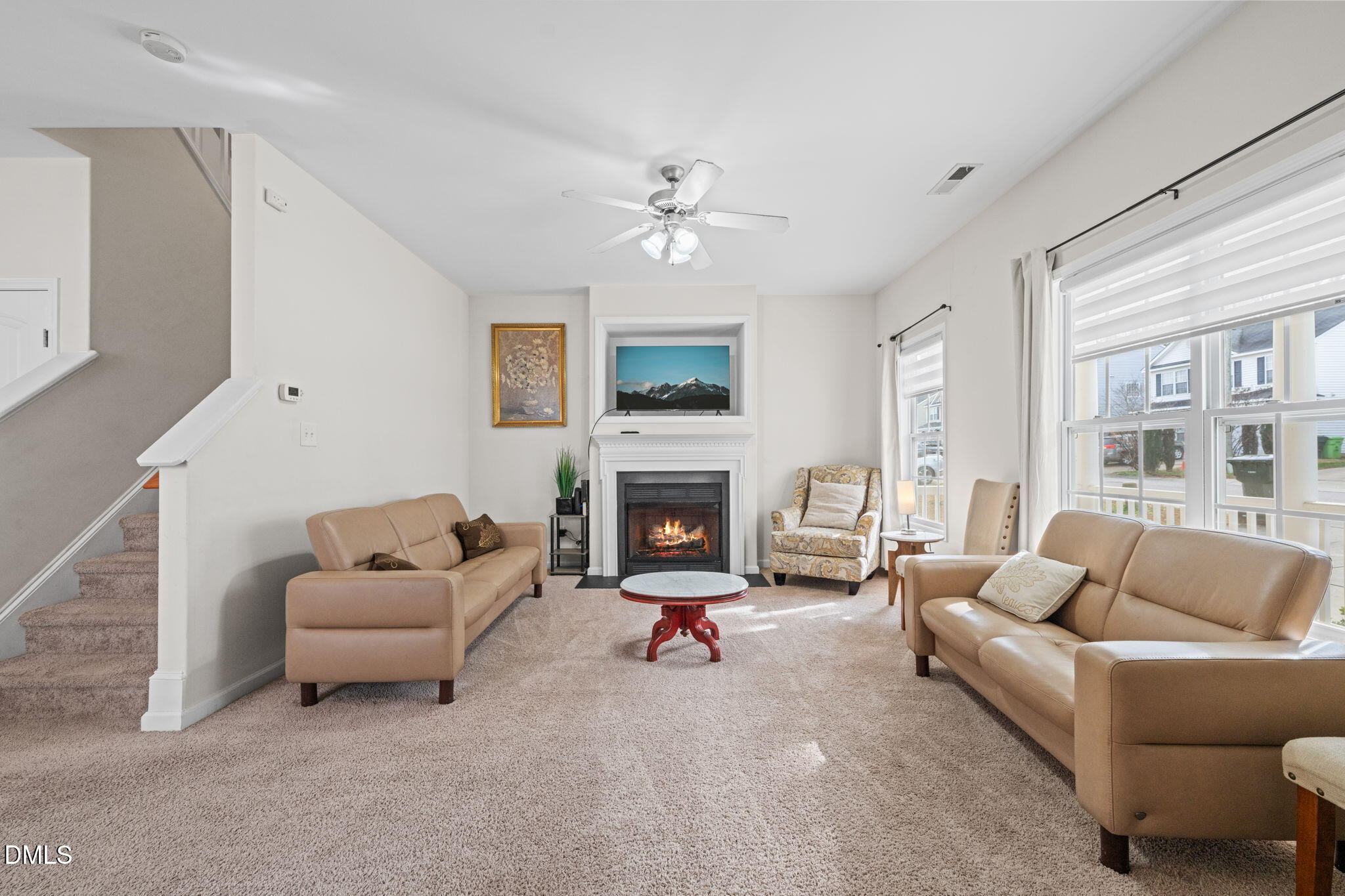 5841 Wynmore Road Raleigh, NC 27610 - Photo 6 of 40 a living room with furniture and a fireplace