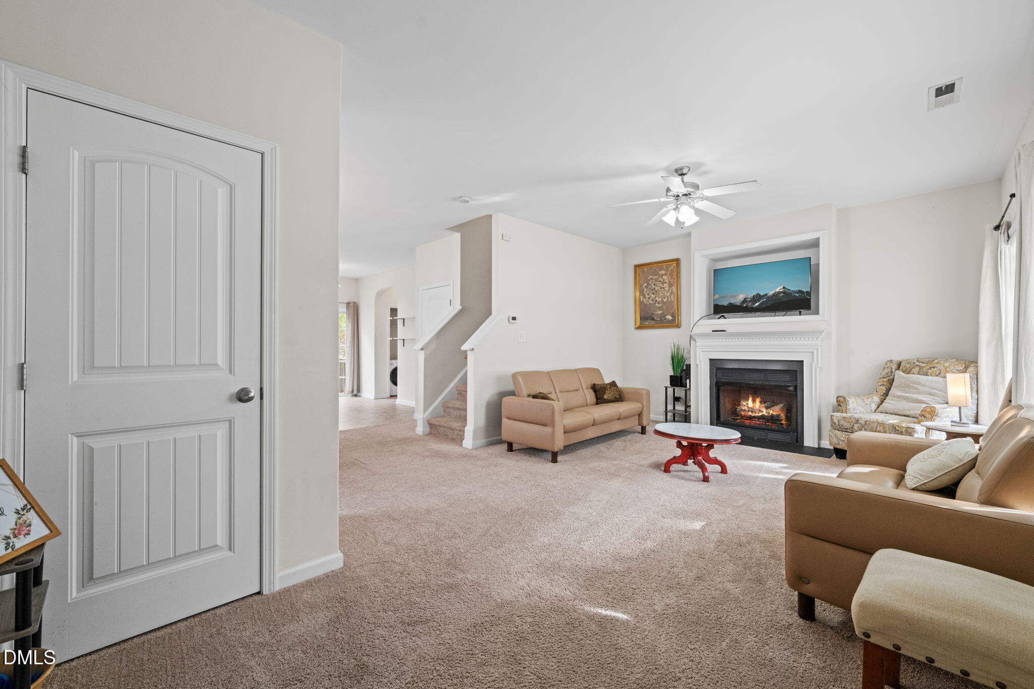 5841 Wynmore Road Raleigh, NC 27610 - Photo 7 of 40 a living room with furniture and a fireplace