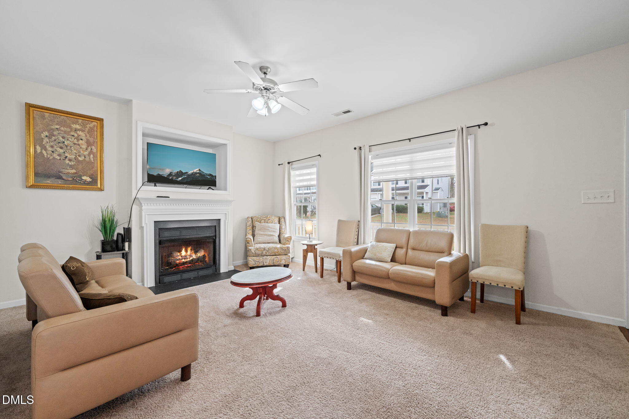 5841 Wynmore Road Raleigh, NC 27610 - Photo 8 of 40 a living room with furniture and a fireplace