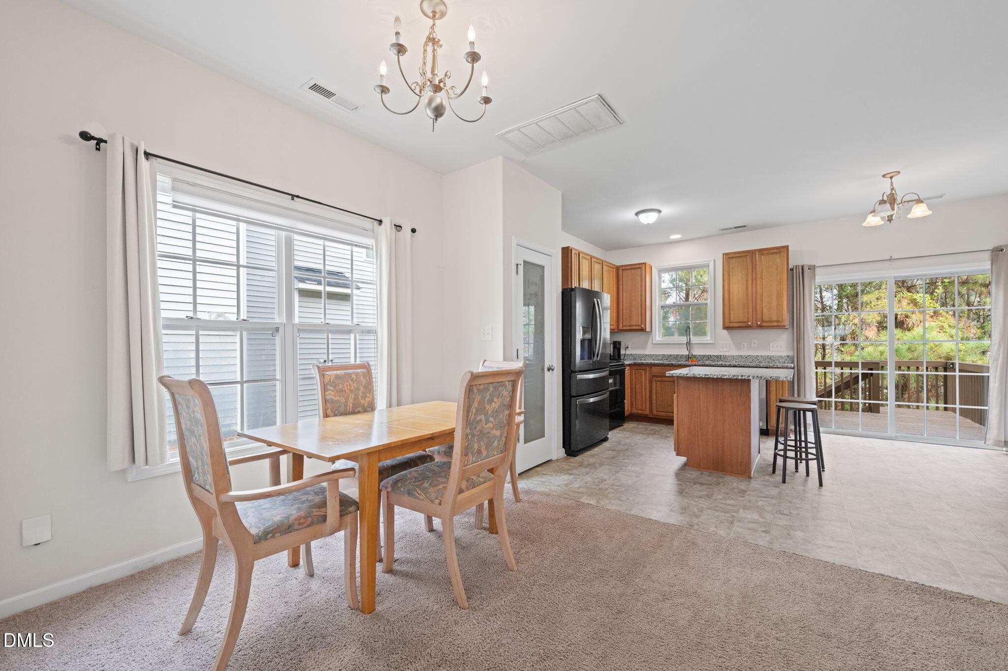 5841 Wynmore Road Raleigh, NC 27610 - Photo 9 of 40 a view of a dining room with furniture window and outside view