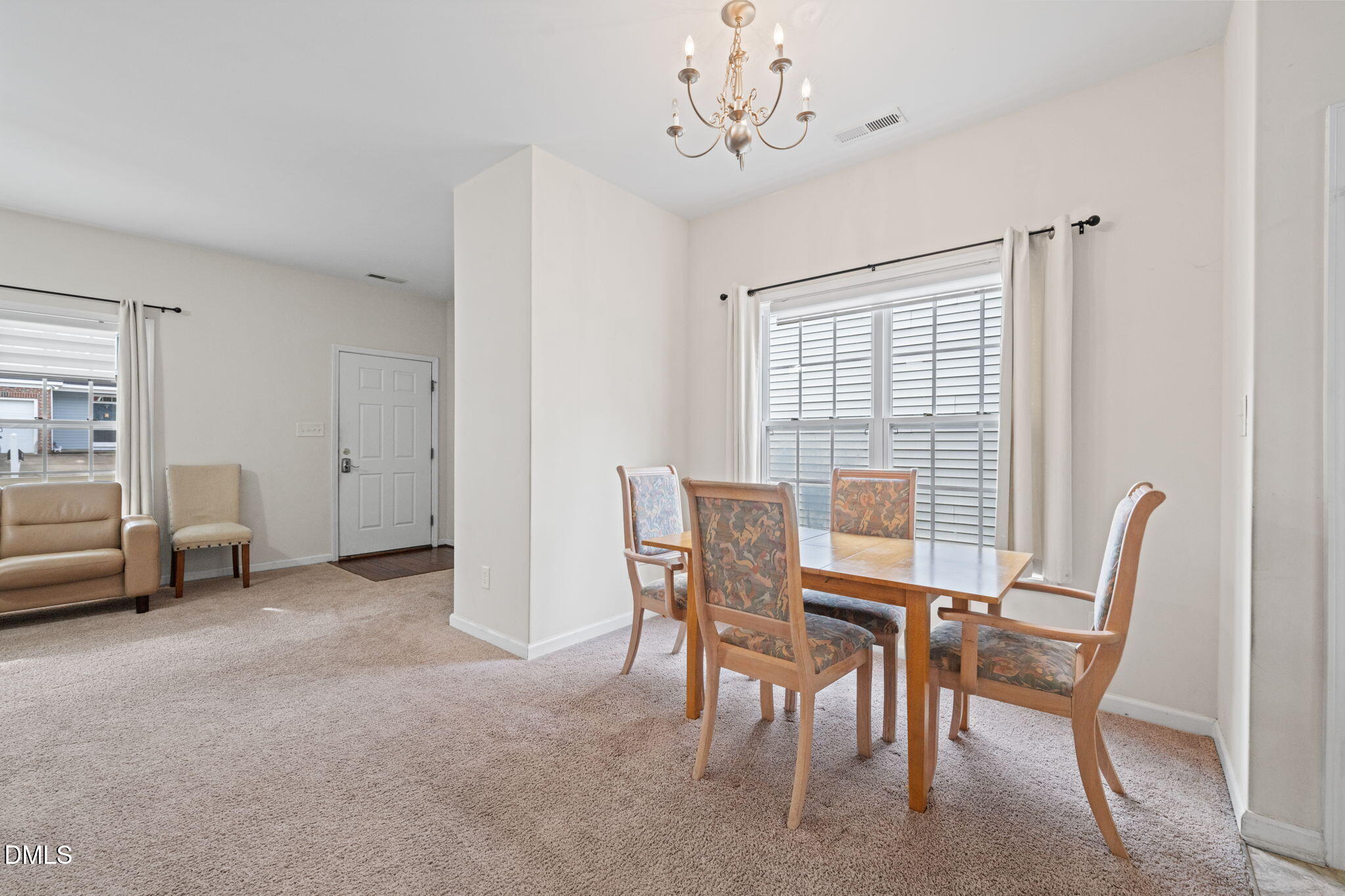 5841 Wynmore Road Raleigh, NC 27610 - Photo 10 of 40 a view of a dining room with furniture window and outside view
