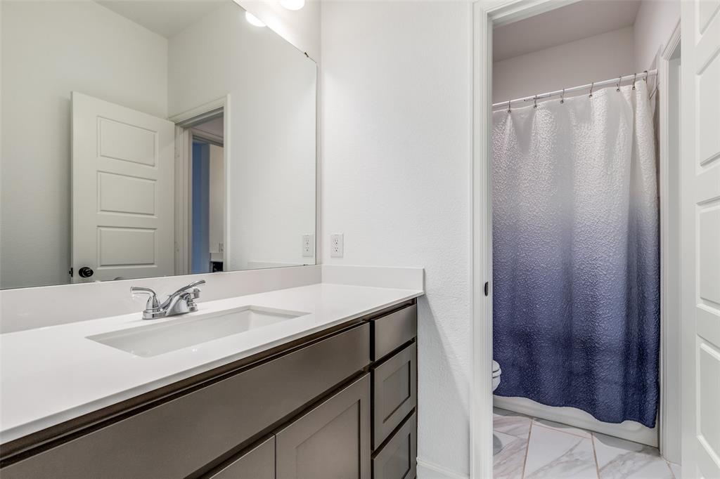 2441 Kates Place Prosper, TX 75078 - Photo 21 of 25 Full bathroom with light marble finish flooring, vanity, and shower / tub combo
