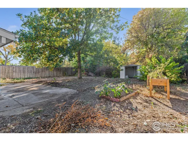 a backyard of a house with yard and outdoor seating