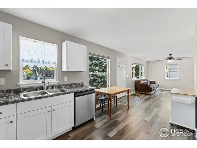 a kitchen with a sink and wooden cabinets