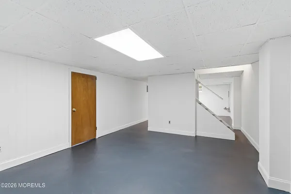 a view of water heater room with stairs