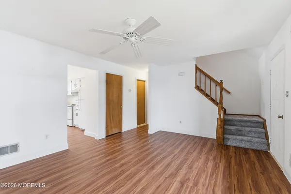 a view of entryway with wooden floor
