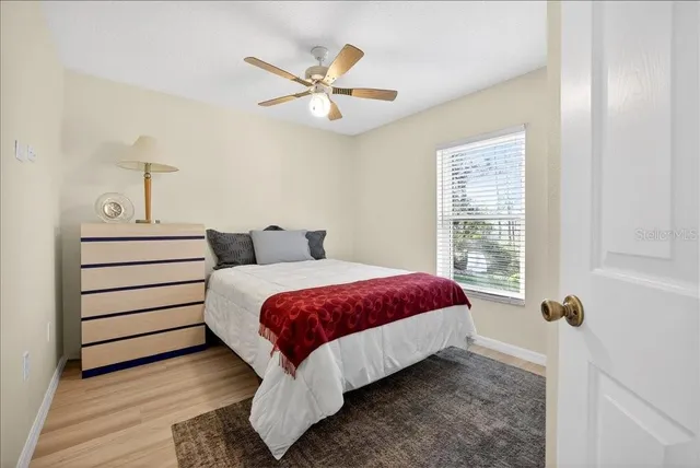 a bathroom with a tub a sink double vanity and a mirror