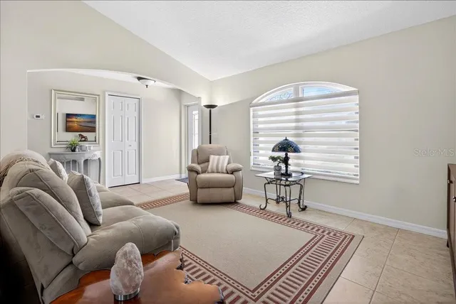 a living room with furniture and a window