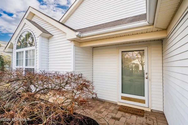 a view of front door and small yard