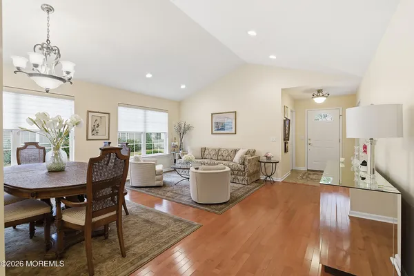 a view of a dining room with furniture window and wooden floor